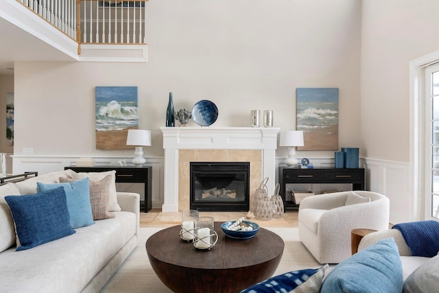 living room with a tile fireplace