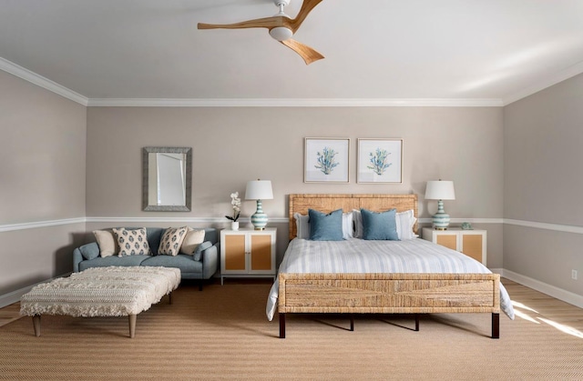 bedroom featuring hardwood / wood-style flooring, ornamental molding, and ceiling fan