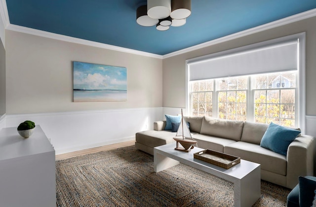 living room featuring wood-type flooring and ornamental molding