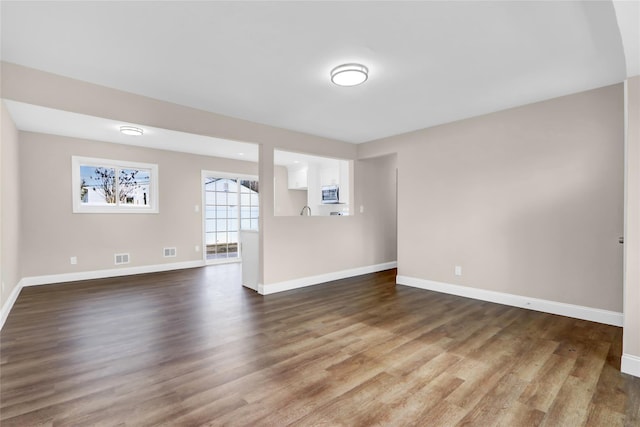 empty room featuring dark hardwood / wood-style floors