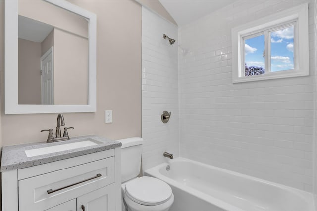 full bathroom featuring vanity, toilet, and tiled shower / bath