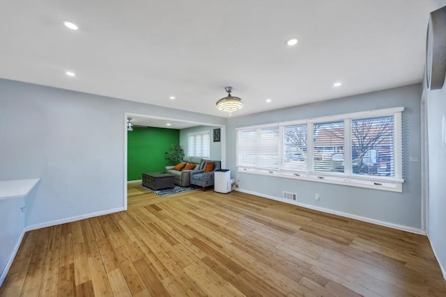 interior space with light wood finished floors, visible vents, recessed lighting, and baseboards