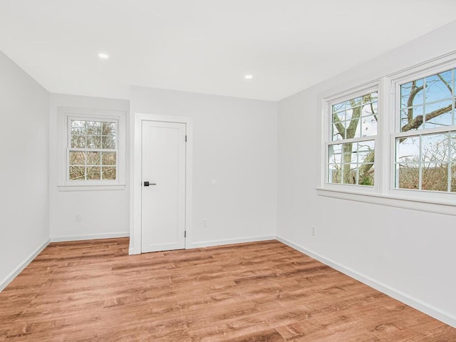 spare room featuring light wood-type flooring