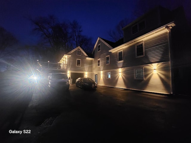 front facade with a garage