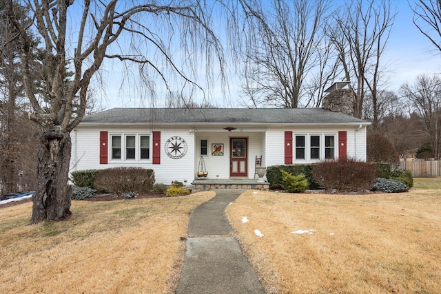 ranch-style home with a front lawn