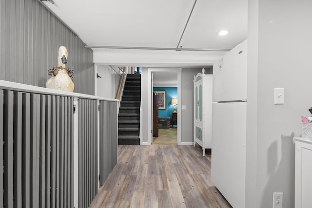 corridor with light hardwood / wood-style flooring