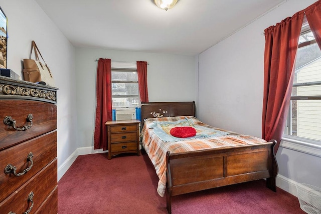 carpeted bedroom with cooling unit and multiple windows