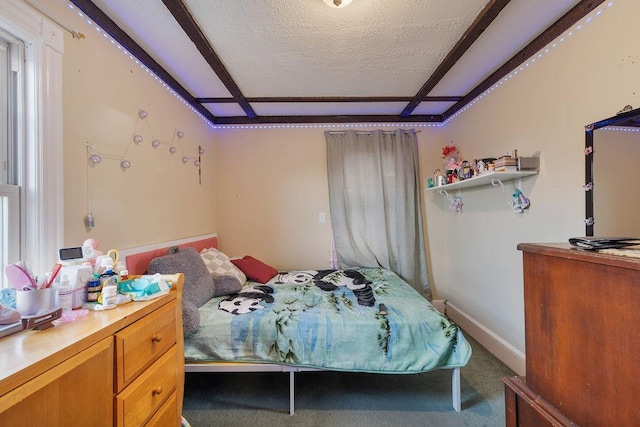 carpeted bedroom with a textured ceiling