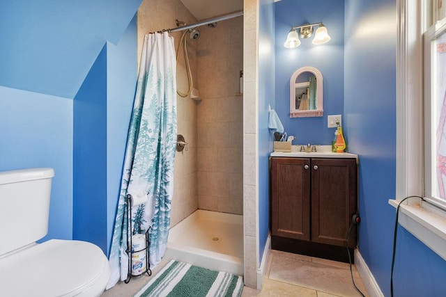 bathroom with toilet, vaulted ceiling, tile patterned flooring, a shower with curtain, and vanity