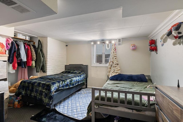 bedroom with crown molding