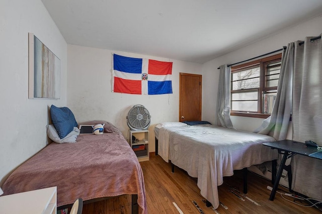 bedroom with hardwood / wood-style flooring