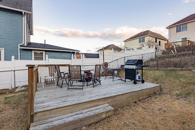 wooden terrace with a grill