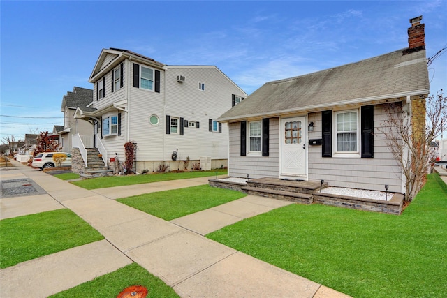 view of front of home with a front yard