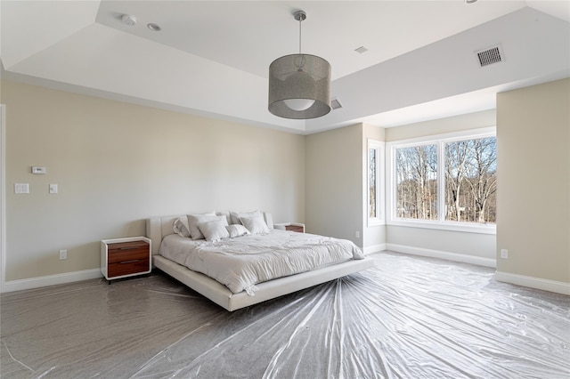 bedroom with a tray ceiling