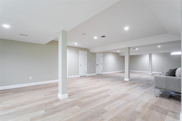 basement featuring light hardwood / wood-style floors