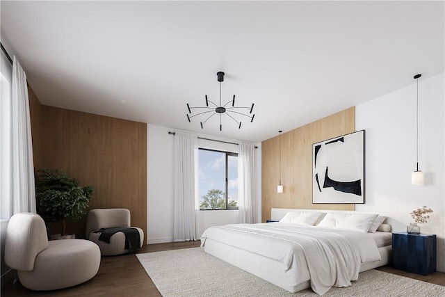 bedroom featuring hardwood / wood-style floors and wooden walls