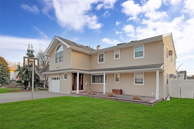 exterior space with a garage and a lawn