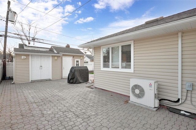 view of patio / terrace featuring an outbuilding, ac unit, and area for grilling