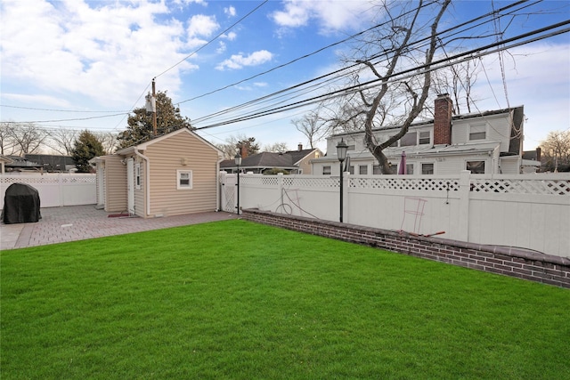 view of yard with an outdoor structure and a patio