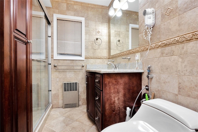 bathroom with tile patterned flooring, tile walls, and vanity