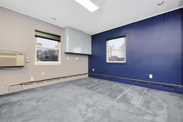 unfurnished room with a baseboard radiator, carpet, and a wall mounted air conditioner