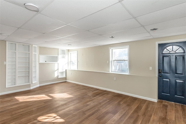 foyer with a drop ceiling and hardwood / wood-style flooring