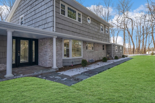 rear view of house with a yard