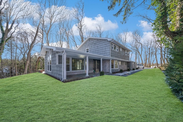 rear view of house with a lawn