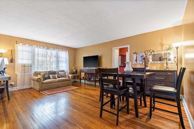 dining space featuring hardwood / wood-style floors