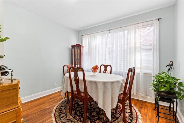 dining area featuring hardwood / wood-style floors