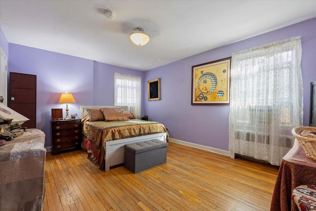 bedroom with light hardwood / wood-style floors