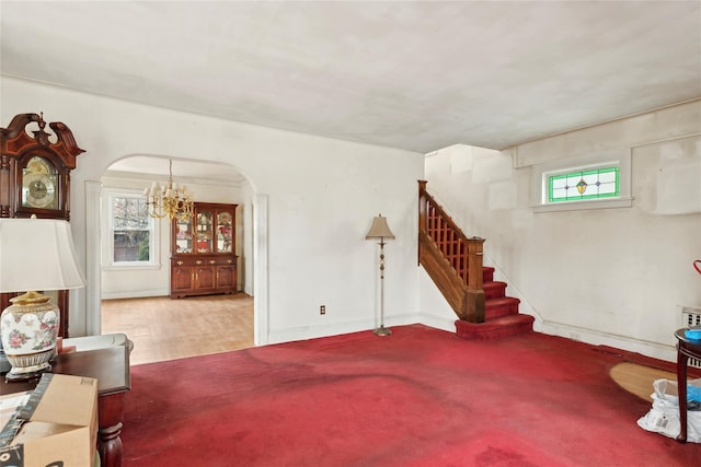 living room featuring carpet flooring and a notable chandelier