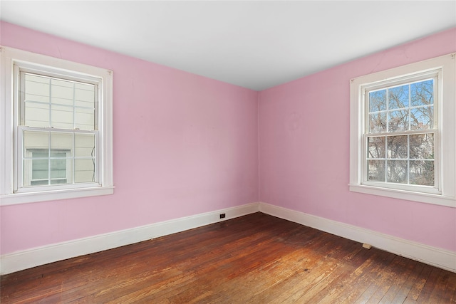 unfurnished room featuring hardwood / wood-style flooring