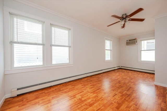 spare room featuring ceiling fan, a baseboard heating unit, an AC wall unit, crown molding, and light wood-type flooring