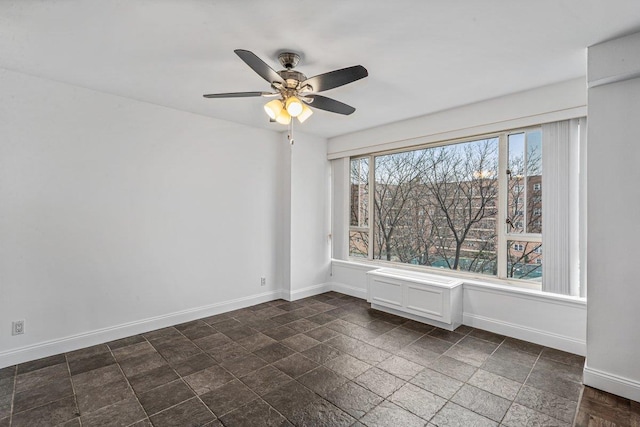 unfurnished room featuring ceiling fan