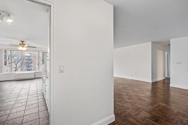 hall with dark parquet flooring