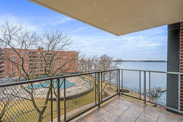 balcony featuring a water view