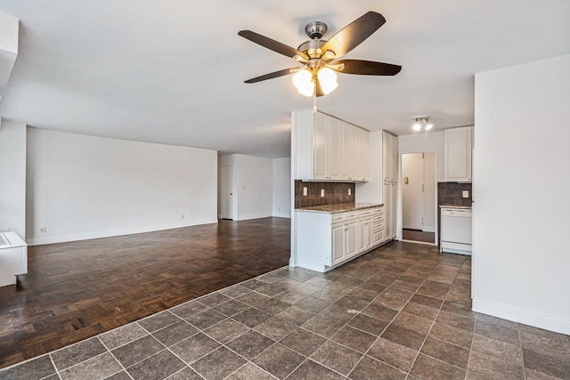 kitchen with dishwasher, white cabinetry, ceiling fan, and tasteful backsplash