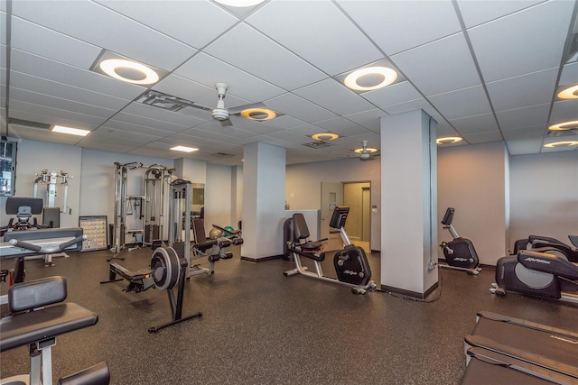 workout area with a paneled ceiling