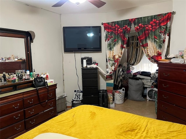 tiled bedroom with ceiling fan