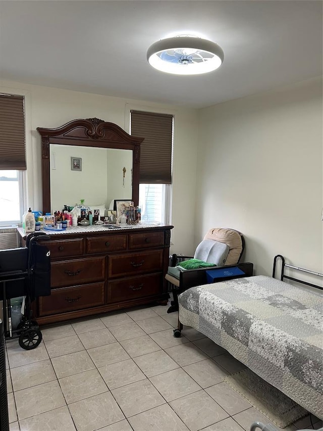 bedroom with light tile patterned flooring