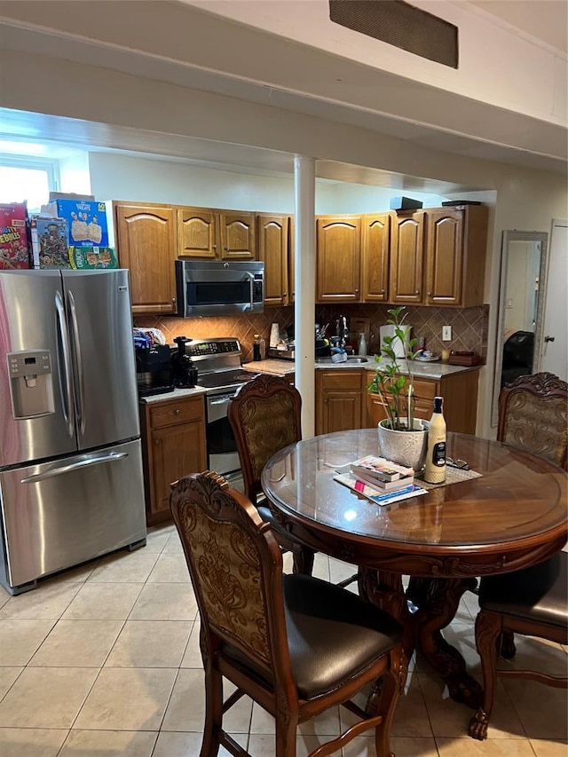 dining area featuring light tile patterned flooring