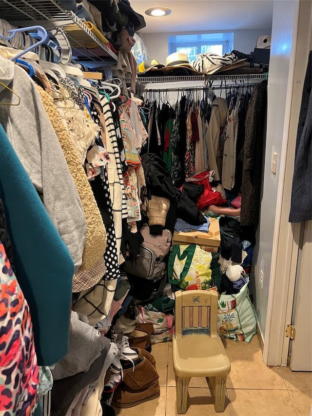 walk in closet featuring light tile patterned flooring