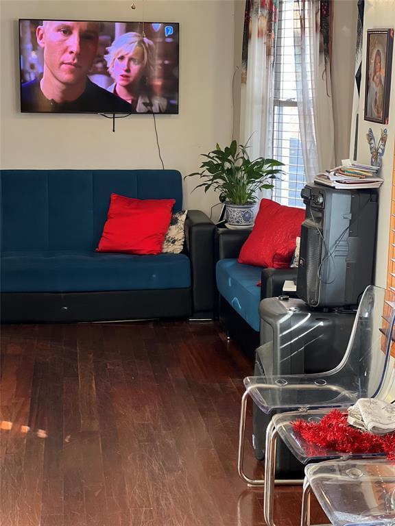 sitting room featuring wood-type flooring