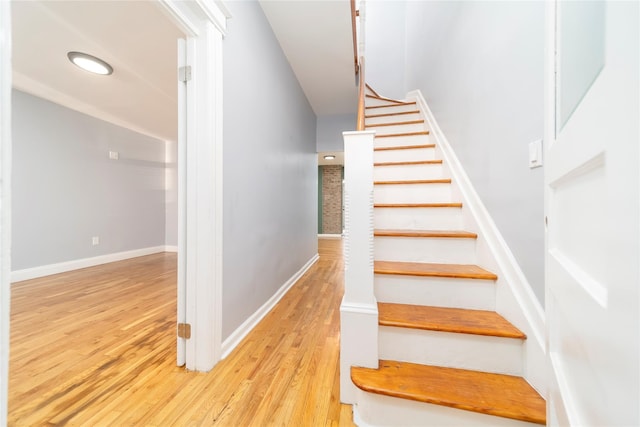 staircase featuring hardwood / wood-style flooring