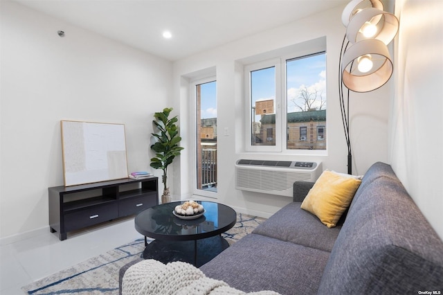 living room featuring an AC wall unit