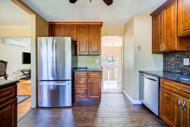 400 Philo St, New Windsor, NY 12553 - kitchen featuring stainless steel appliances, a wall unit AC, a ceiling fan, dark wood-style flooring, and backsplash