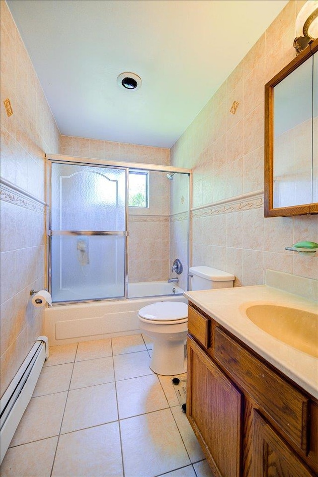 400 Philo St, New Windsor, NY 12553 - full bath featuring tile walls, a baseboard heating unit, tile patterned floors, enclosed tub / shower combo, and vanity