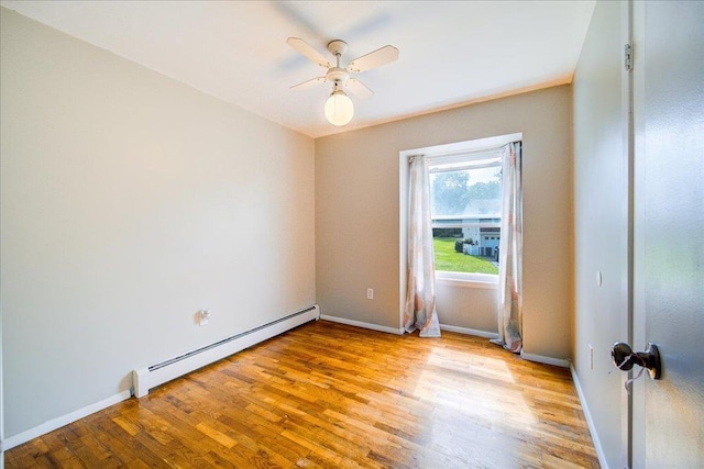 400 Philo St, New Windsor, NY 12553 - spare room featuring a baseboard radiator, a ceiling fan, light wood-style floors, and baseboards