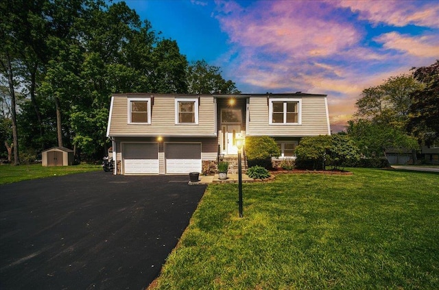 400 Philo St, New Windsor, NY 12553 - split foyer home with a storage unit, an attached garage, driveway, and a front lawn